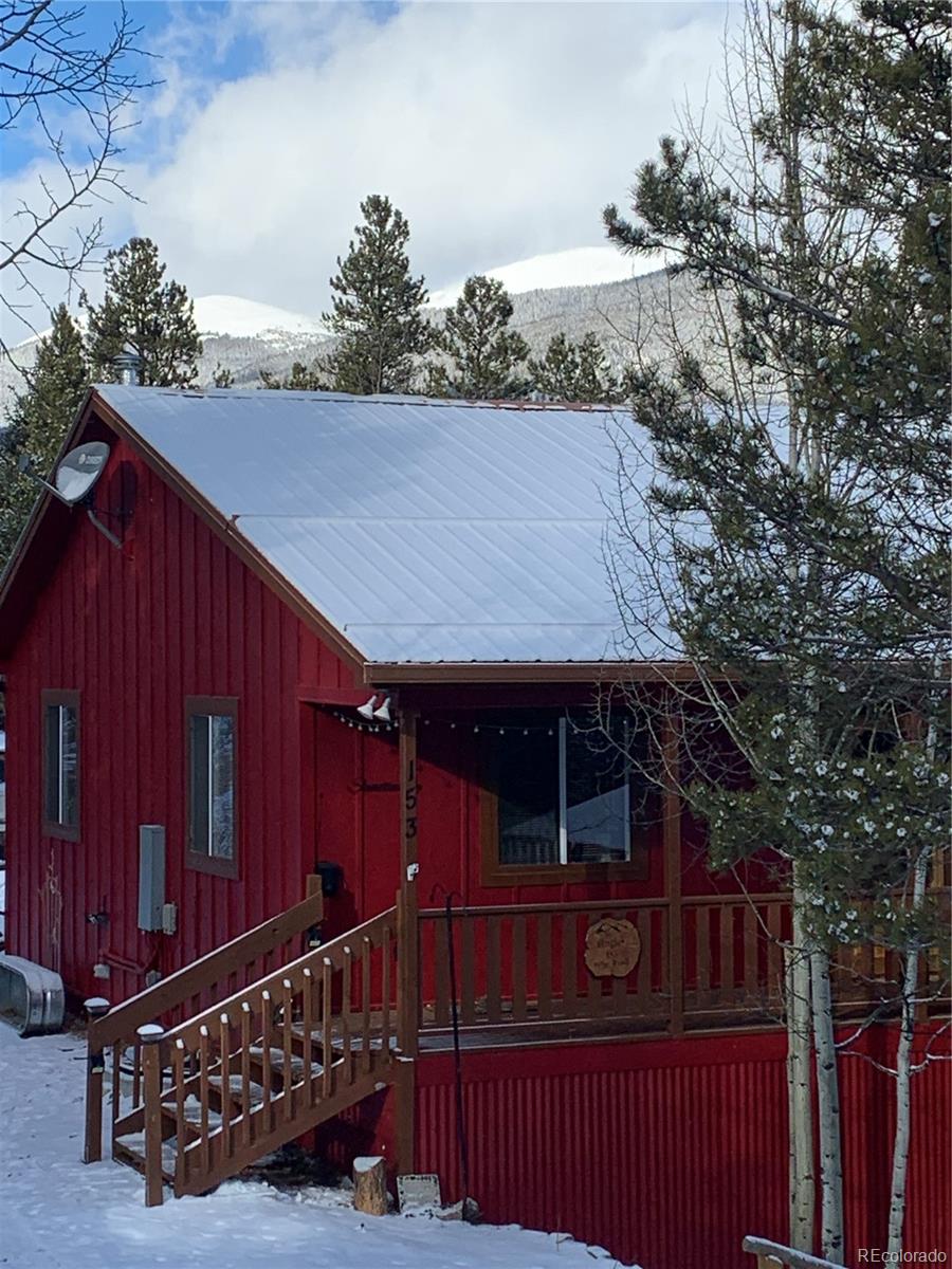 153 Wise Road Bailey, CO 80421 - Photo 36 of 38 a view of house with backyard and deck