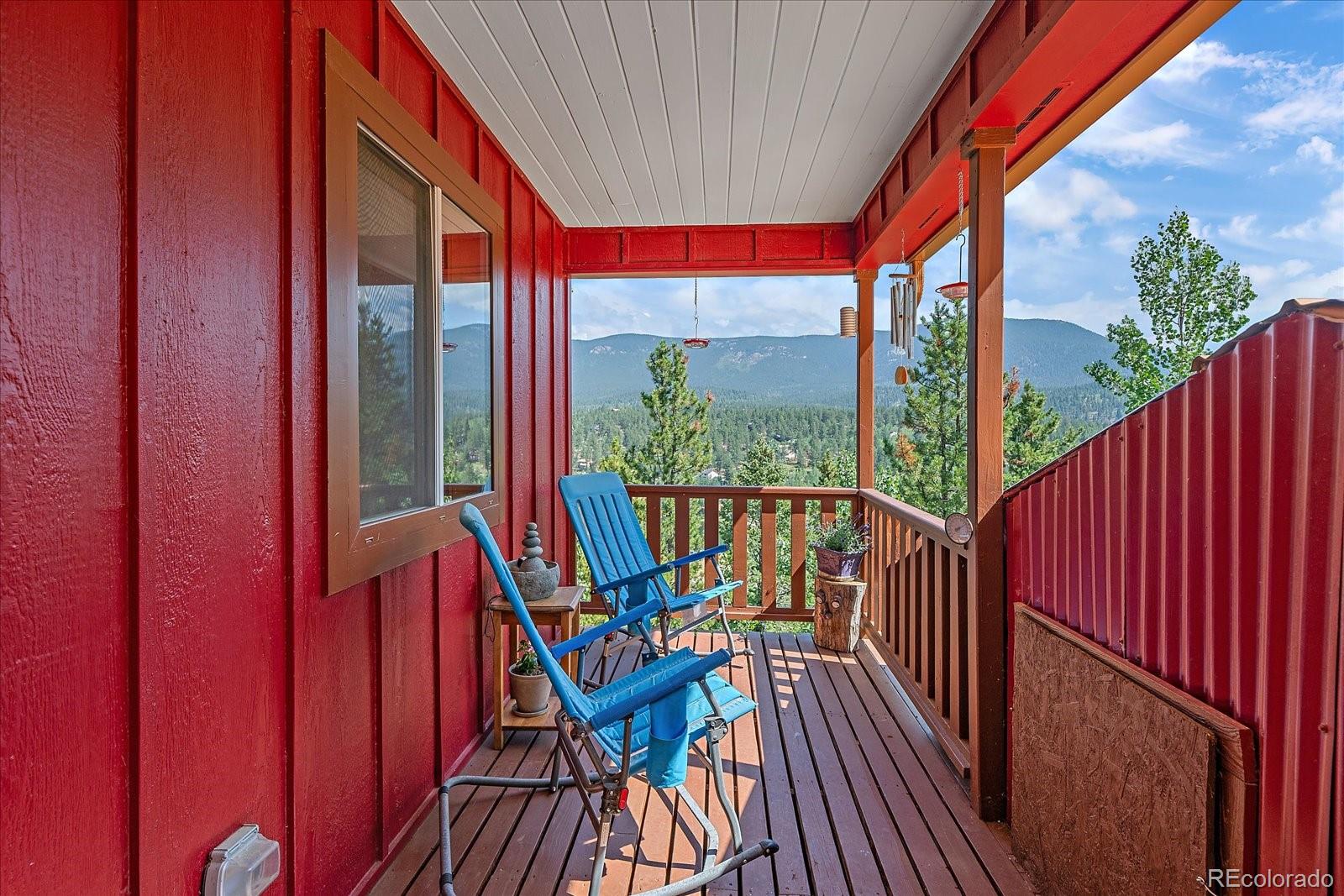 153 Wise Road Bailey, CO 80421 - Photo 4 of 38 a view of balcony with furniture and wooden deck
