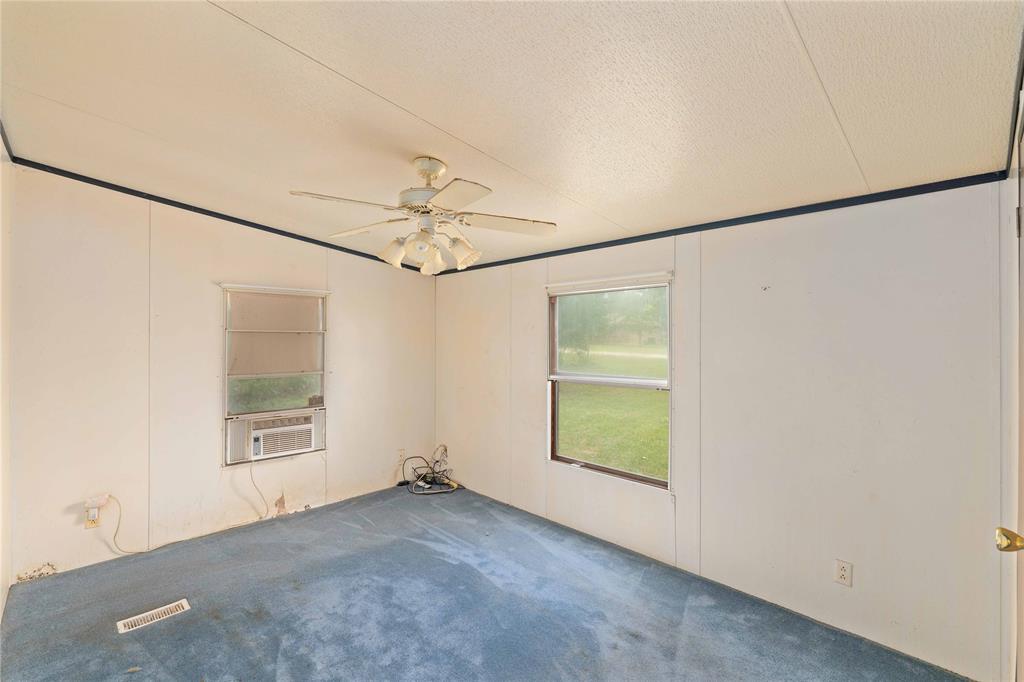 210 7th Street Blanket, TX 76432 - Photo 14 of 33 an empty room with windows and entrance