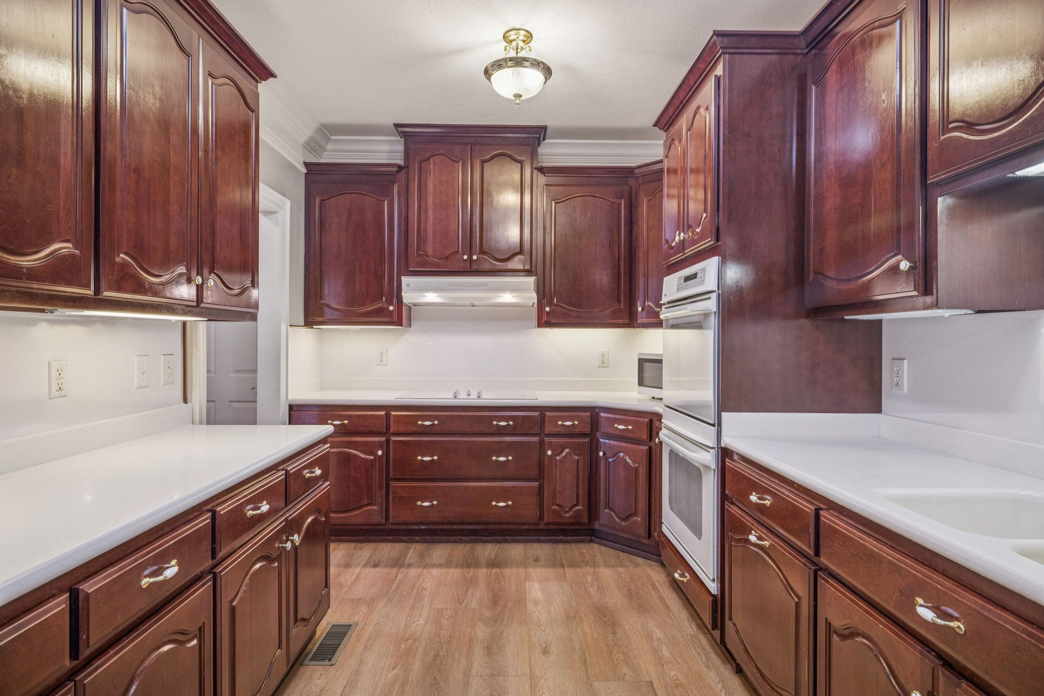 149 Upper Station Camp Creek Road Gallatin, TN 37066 - Photo 31 of 83 a kitchen with stainless steel appliances granite countertop wooden cabinets a stove top oven a sink and dishwasher