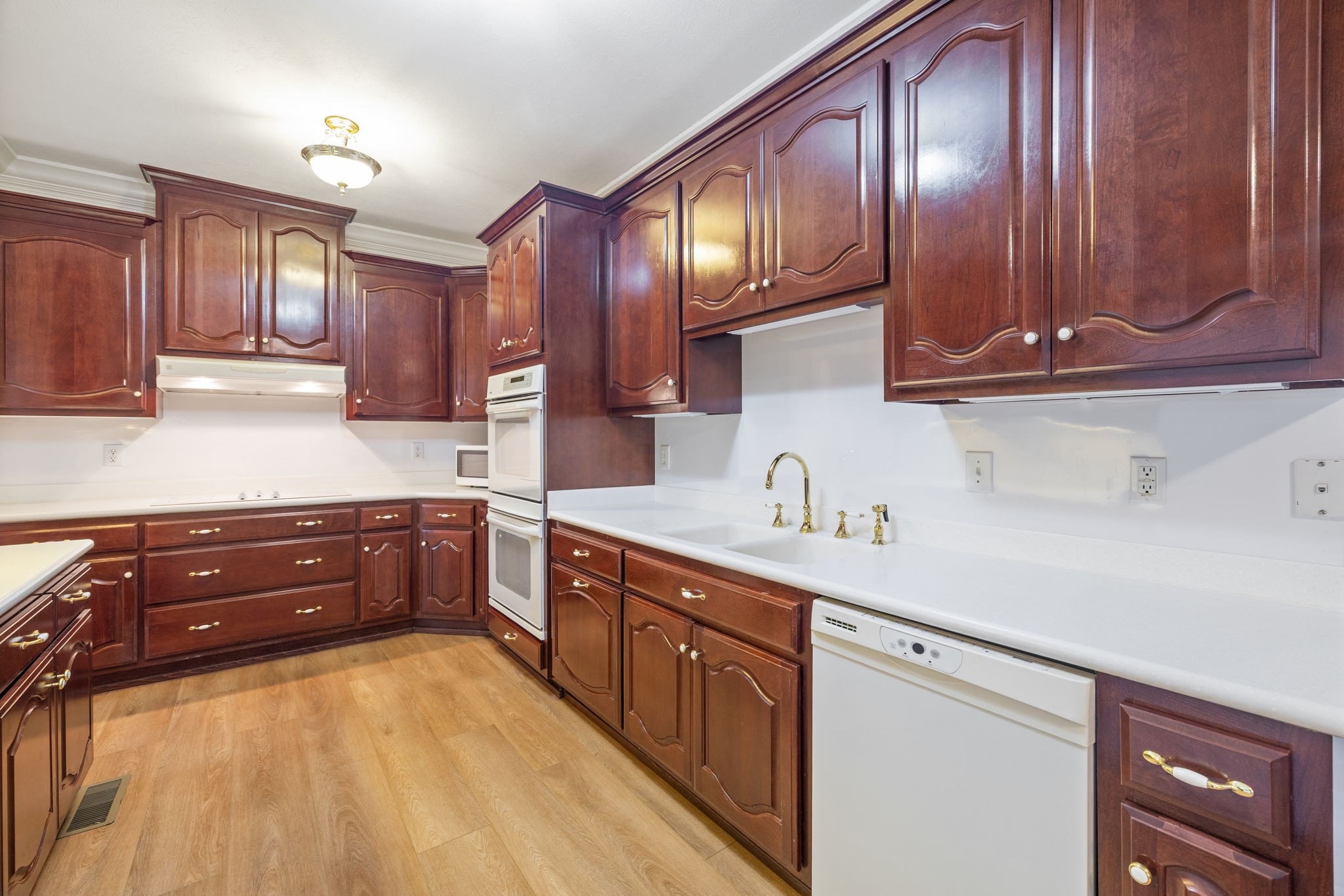 149 Upper Station Camp Creek Road Gallatin, TN 37066 - Photo 35 of 83 a kitchen with stainless steel appliances granite countertop wooden cabinets a stove a sink and dishwasher