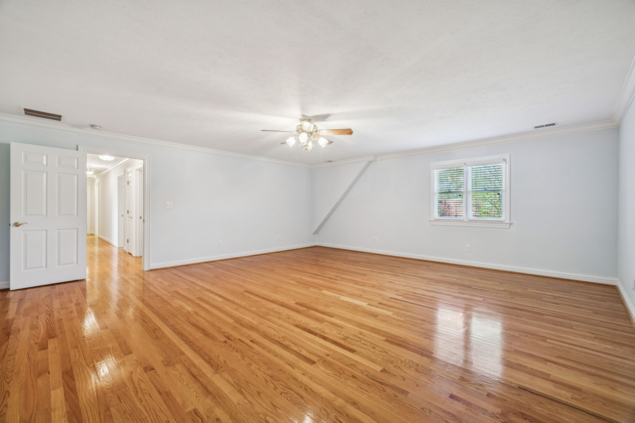 149 Upper Station Camp Creek Road Gallatin, TN 37066 - Photo 45 of 83 a view of a livingroom with wooden floor and a ceiling fan