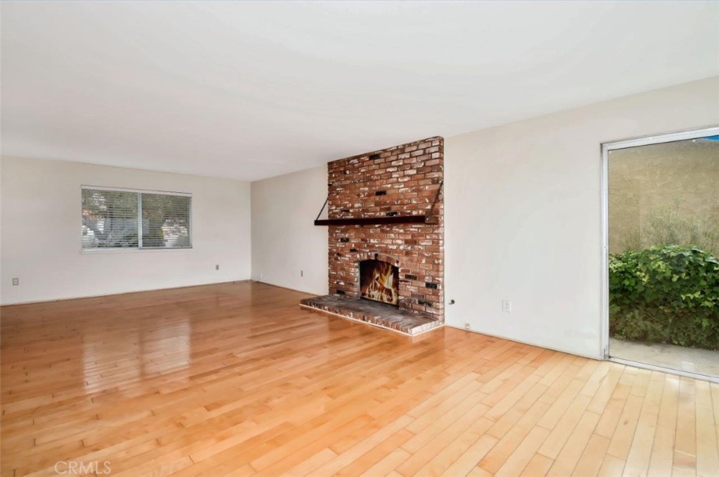6803 Verde Ridge Road Rancho Palos Verdes, CA 90275 - Photo 8 of 26 a view of an empty room with wooden floor and a window