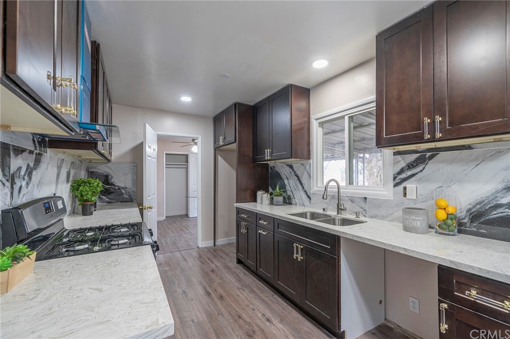 10941 Mac Street Anaheim, CA 92804 - Photo 14 of 41 a kitchen with a sink appliances and cabinets