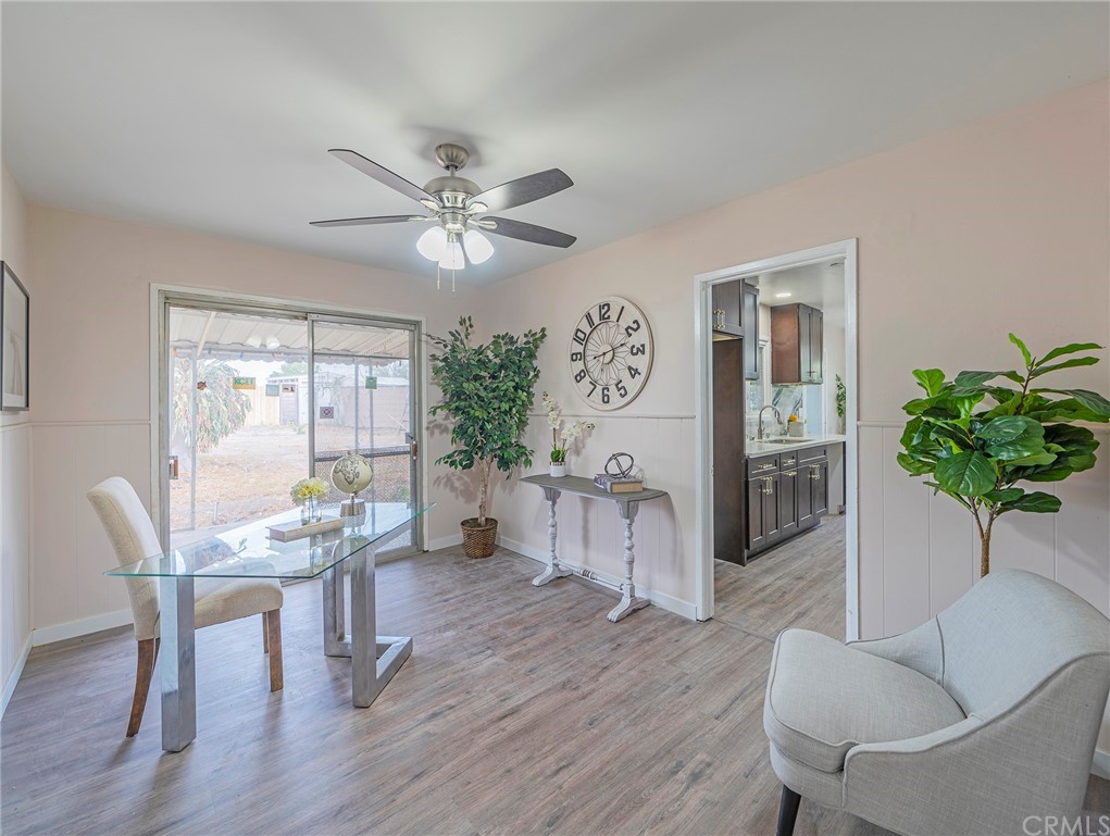 10941 Mac Street Anaheim, CA 92804 - Photo 19 of 41 a view of a livingroom with furniture a ceiling fan and wooden floor
