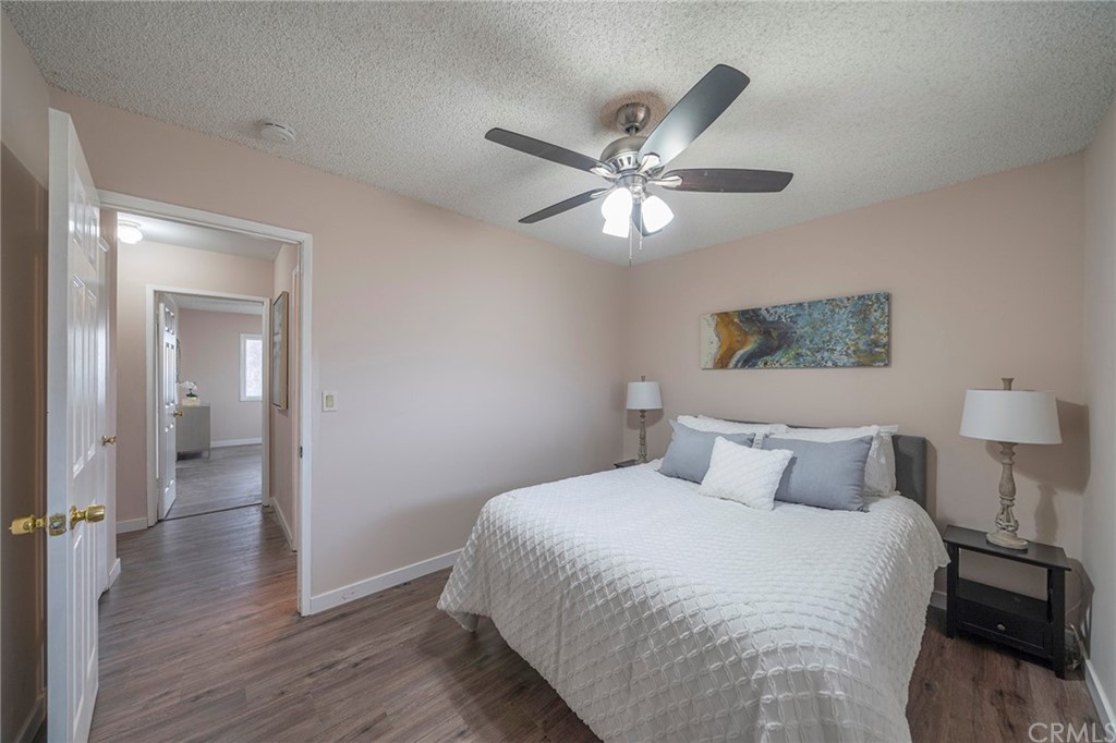 10941 Mac Street Anaheim, CA 92804 - Photo 22 of 41 a bedroom with a large bed and a chandelier