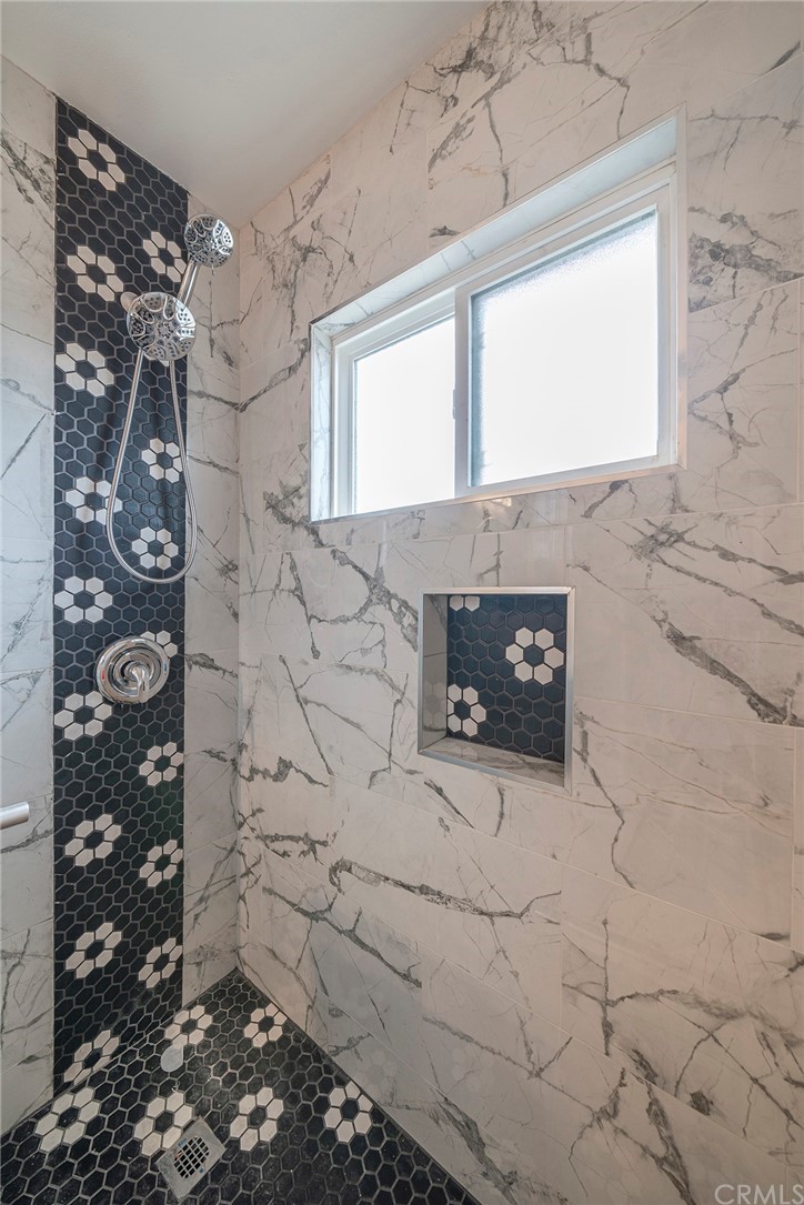 10941 Mac Street Anaheim, CA 92804 - Photo 24 of 41 a bathroom with a sink and a shower