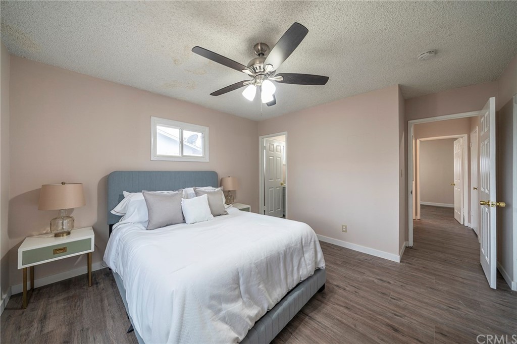 10941 Mac Street Anaheim, CA 92804 - Photo 27 of 41 a bedroom with a bed and a chandelier