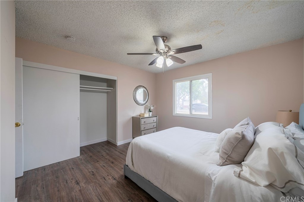 10941 Mac Street Anaheim, CA 92804 - Photo 28 of 41 a bedroom with a bed and a chandelier