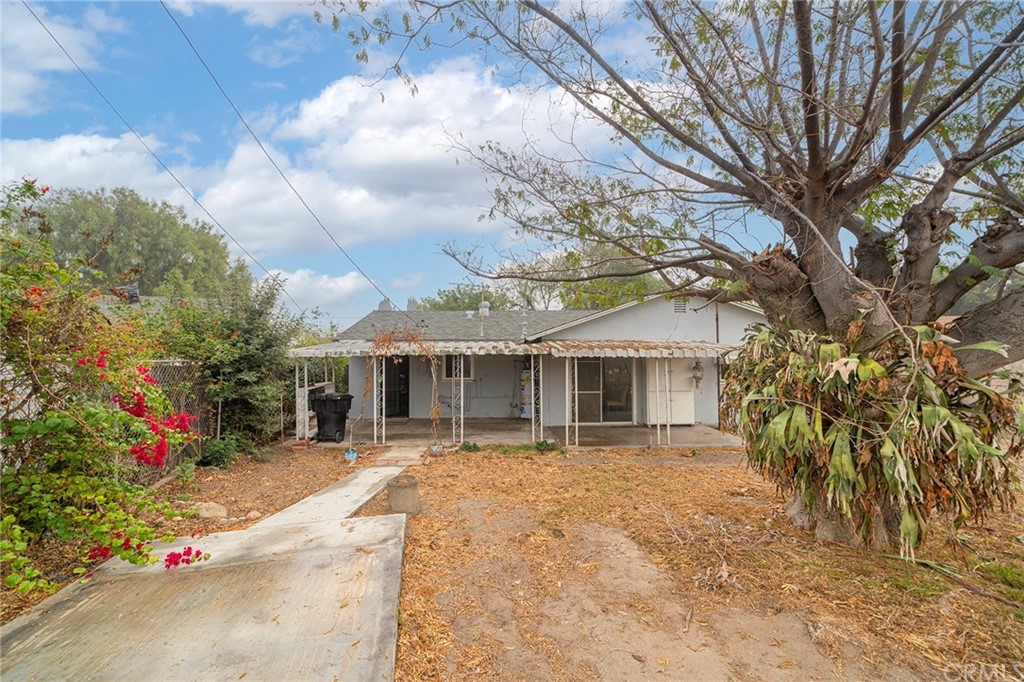 10941 Mac Street Anaheim, CA 92804 - Photo 34 of 41 a front view of house with yard and trees around