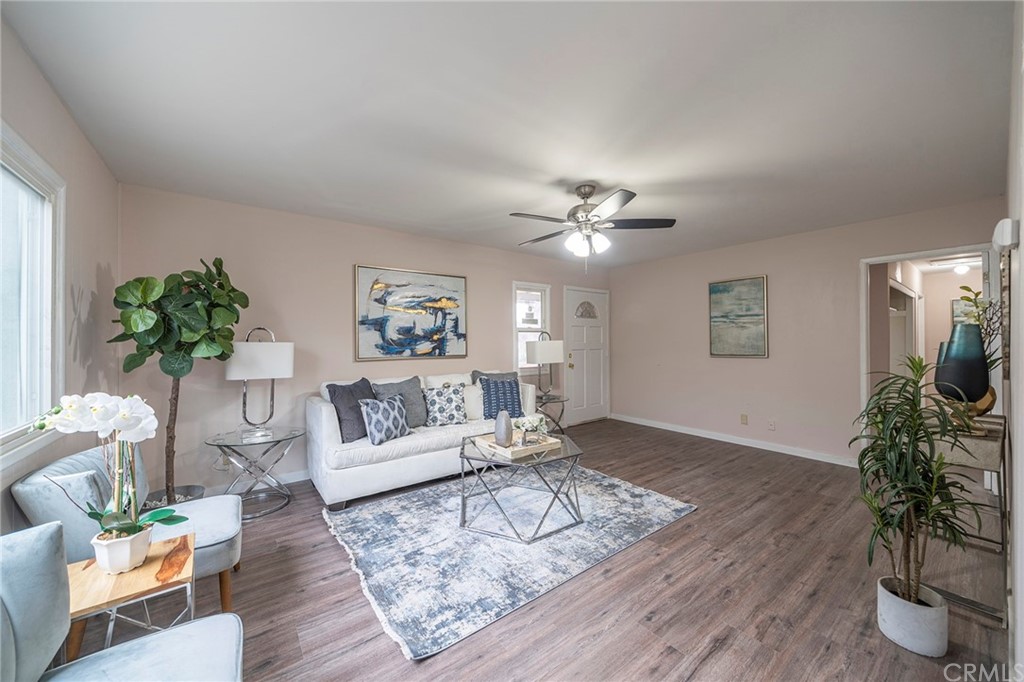 10941 Mac Street Anaheim, CA 92804 - Photo 6 of 41 a living room with furniture and a potted plant