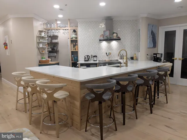 a large kitchen with a table and chairs in it
