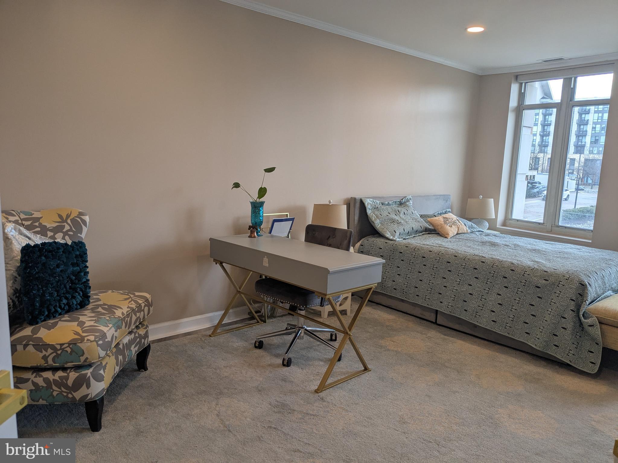 100 Harborview Drive, Unit 211 Baltimore, MD 21230 - Photo 12 of 25 a living room with furniture and a window