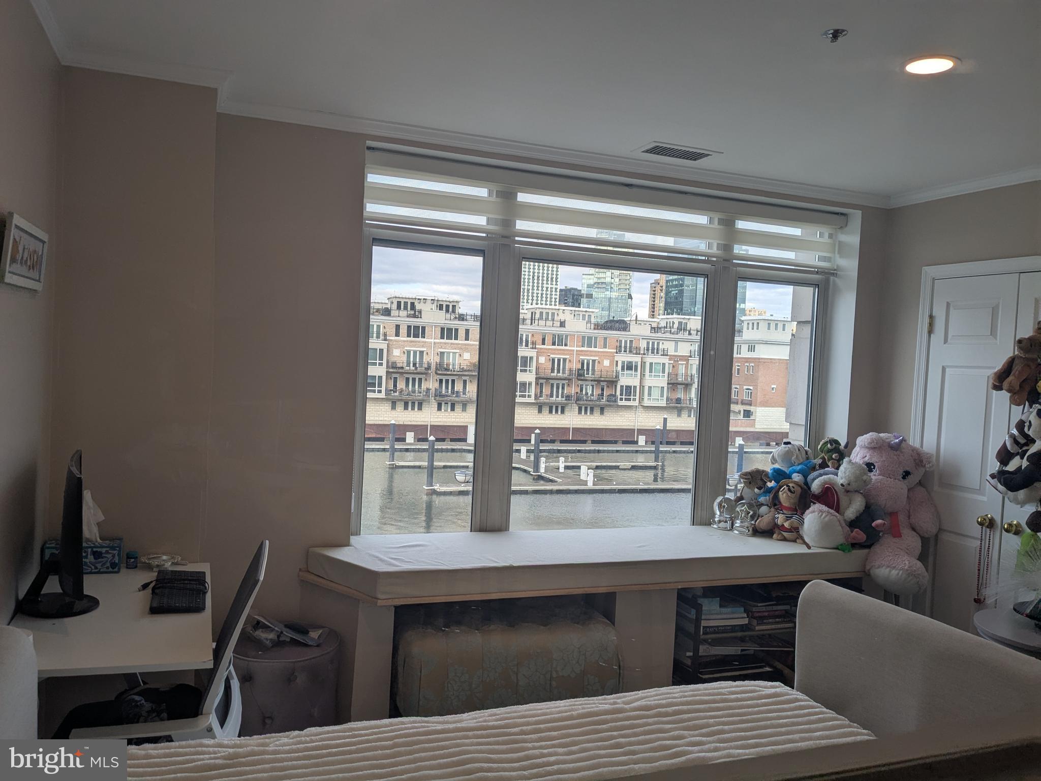 100 Harborview Drive, Unit 211 Baltimore, MD 21230 - Photo 17 of 25 a living room with furniture and a window