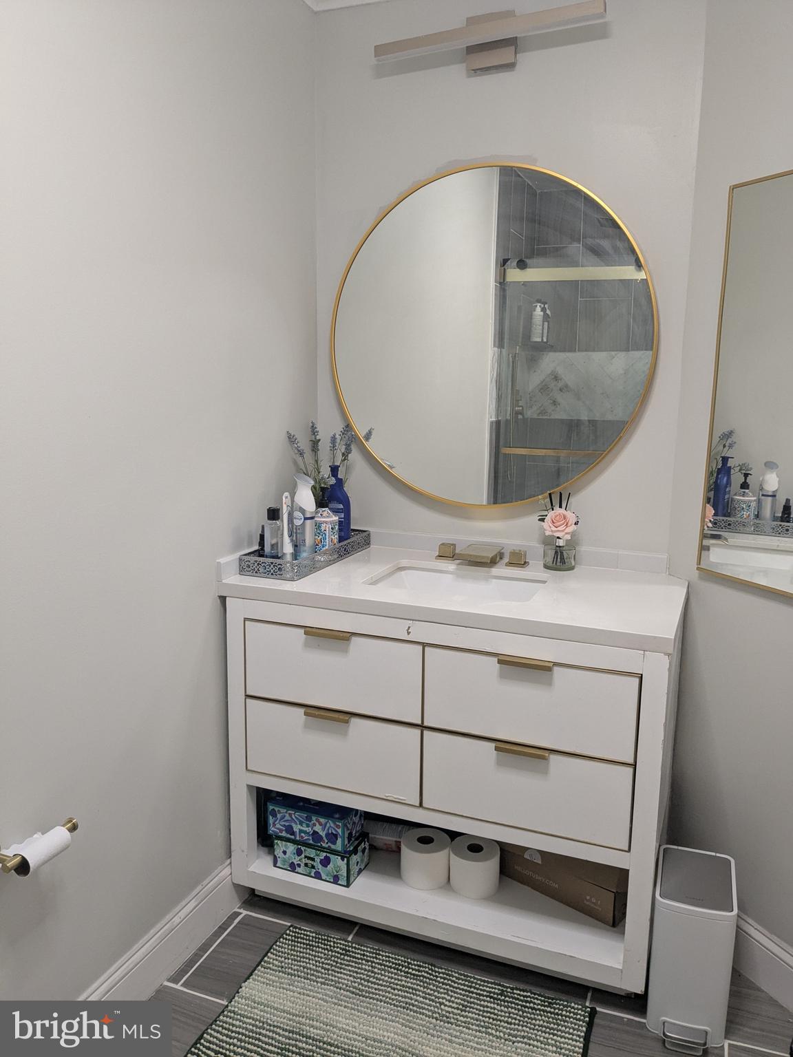 100 Harborview Drive, Unit 211 Baltimore, MD 21230 - Photo 20 of 25 a bathroom with a sink and a mirror