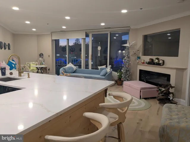 a living room with fireplace furniture and a flat screen tv