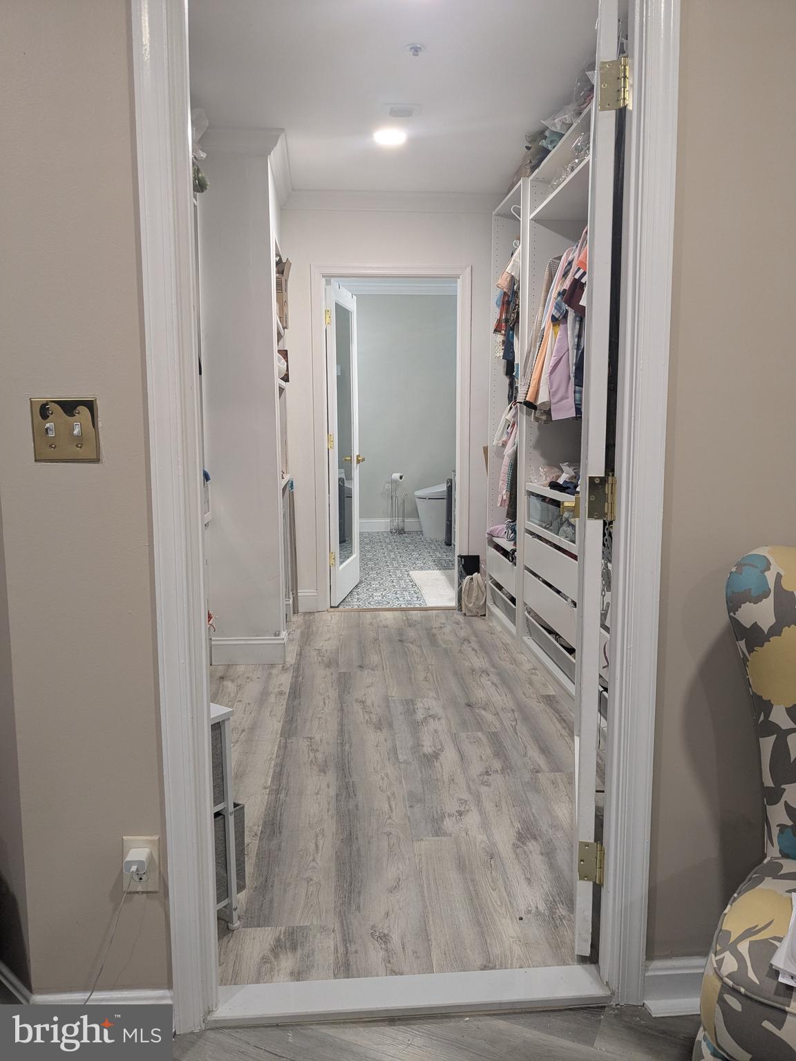 100 Harborview Drive, Unit 211 Baltimore, MD 21230 - Photo 9 of 25 a view of a hallway with wooden floor and furniture