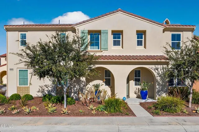 a front view of house with small garden