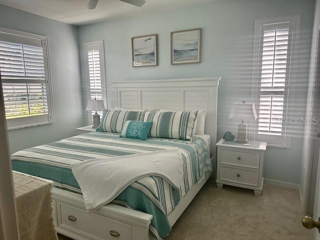 8369 Wingate Drive, Unit 2114 Sarasota, FL 34238 - Photo 11 of 26 a bedroom with a bed and a window