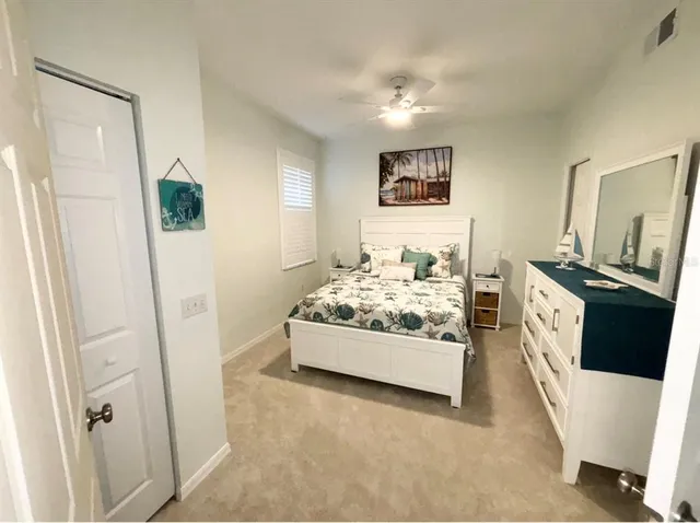 a view of living room and bedroom with furniture