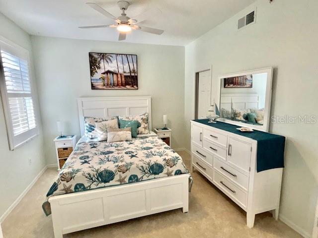 8369 Wingate Drive, Unit 2114 Sarasota, FL 34238 - Photo 17 of 26 a room with a bed and window