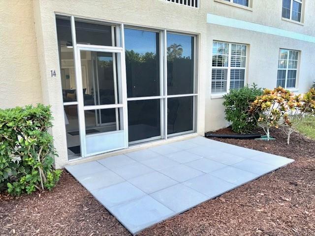 8369 Wingate Drive, Unit 2114 Sarasota, FL 34238 - Photo 22 of 26 a view of front door and potted plants