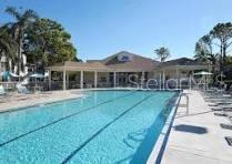 8369 Wingate Drive, Unit 2114 Sarasota, FL 34238 - Photo 23 of 26 a view of a house with a yard