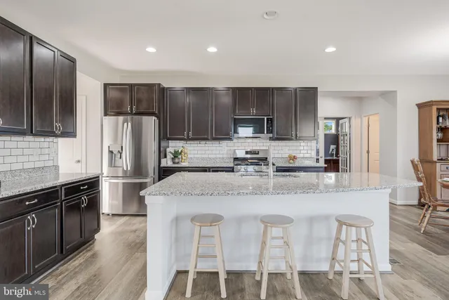 a view of a patio with couches chairs dining table and chairs