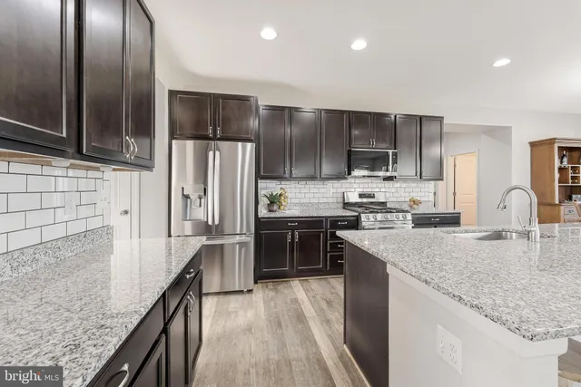 a view of a backyard with sitting area