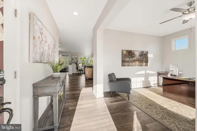 a living room with furniture fireplace and window