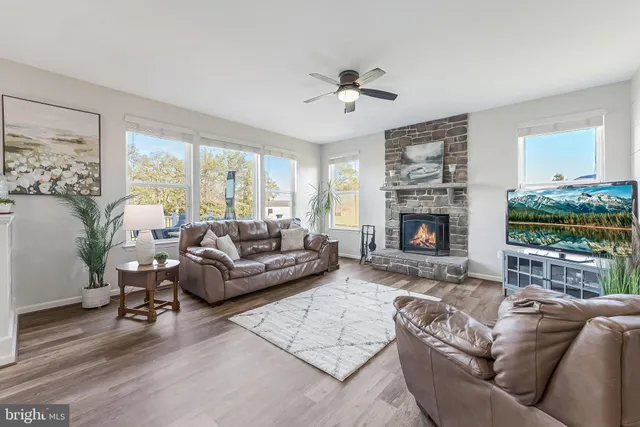 a large kitchen with stainless steel appliances lots of counter space a sink refrigerator and cabinets