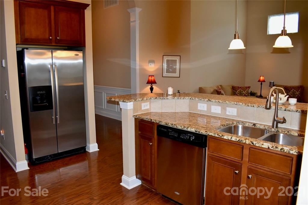 1321 Secret Path Drive Fort Mill, SC 29708 - Photo 8 of 40 a kitchen with stainless steel appliances granite countertop a refrigerator a sink and dishwasher