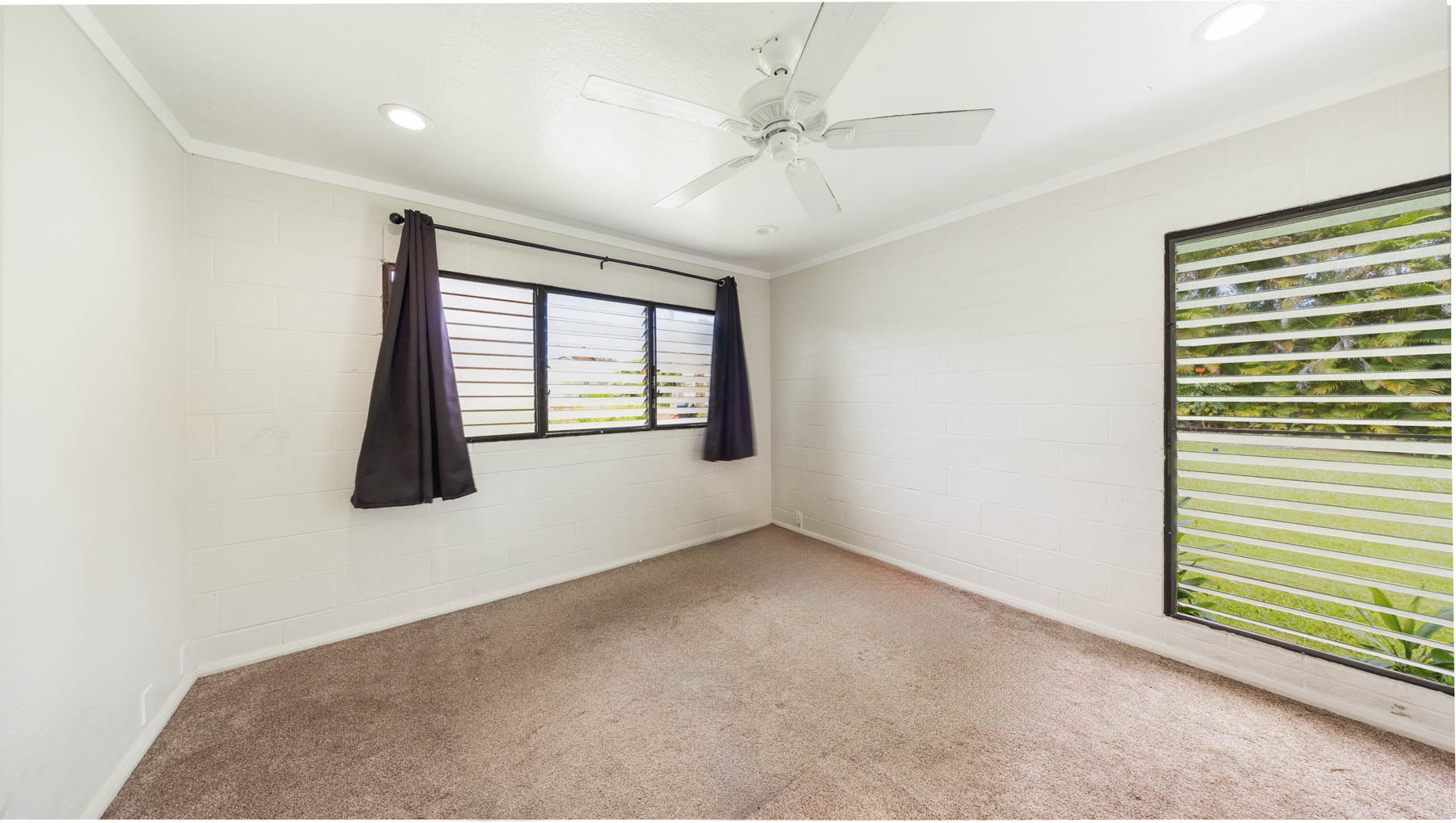 328 Molo Street Kapaa, HI 96746 - Photo 13 of 30 an empty room with windows and fan