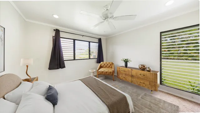 a bedroom with bed and window