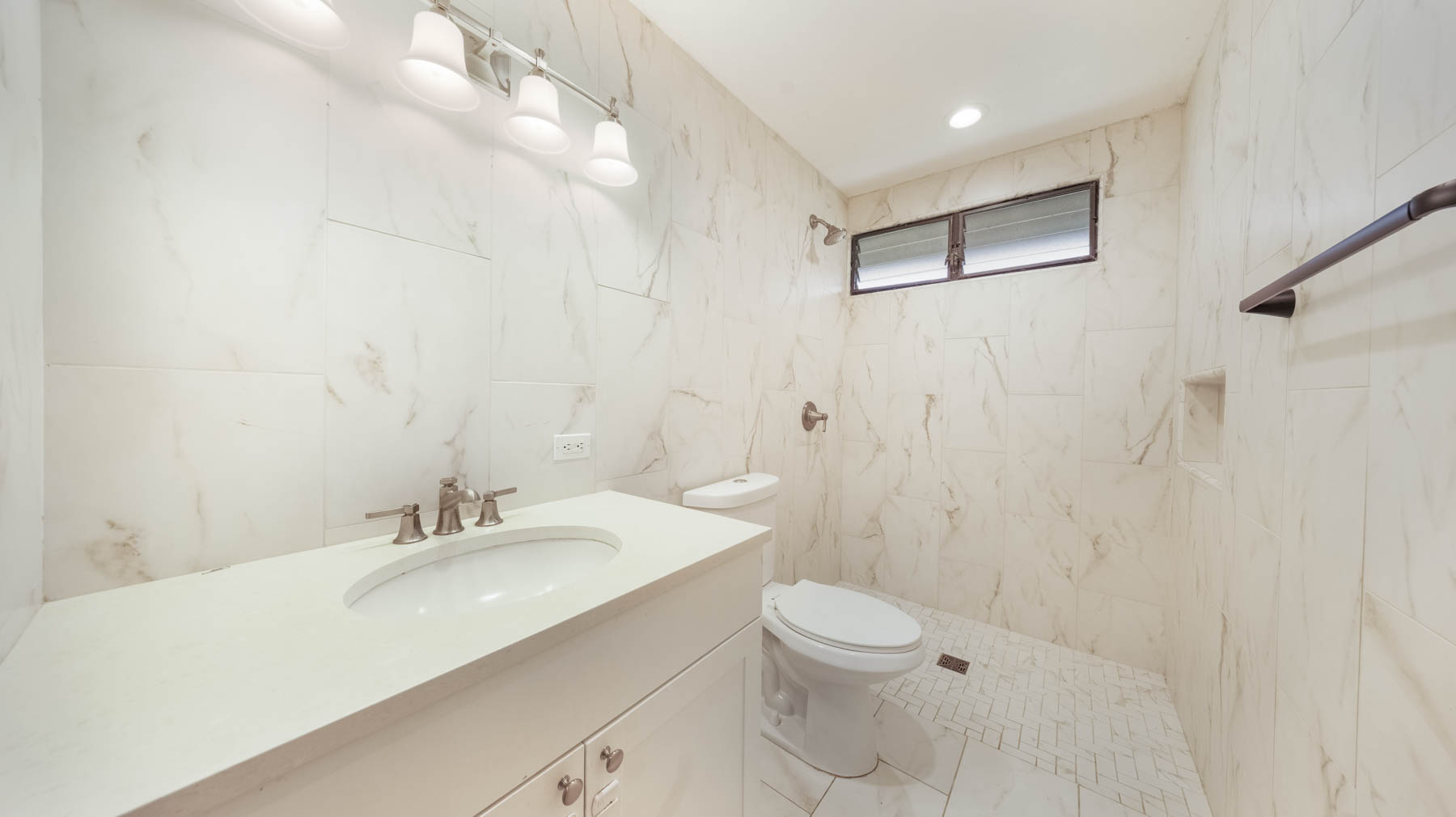 328 Molo Street Kapaa, HI 96746 - Photo 17 of 30 a bathroom with a sink a toilet and shower