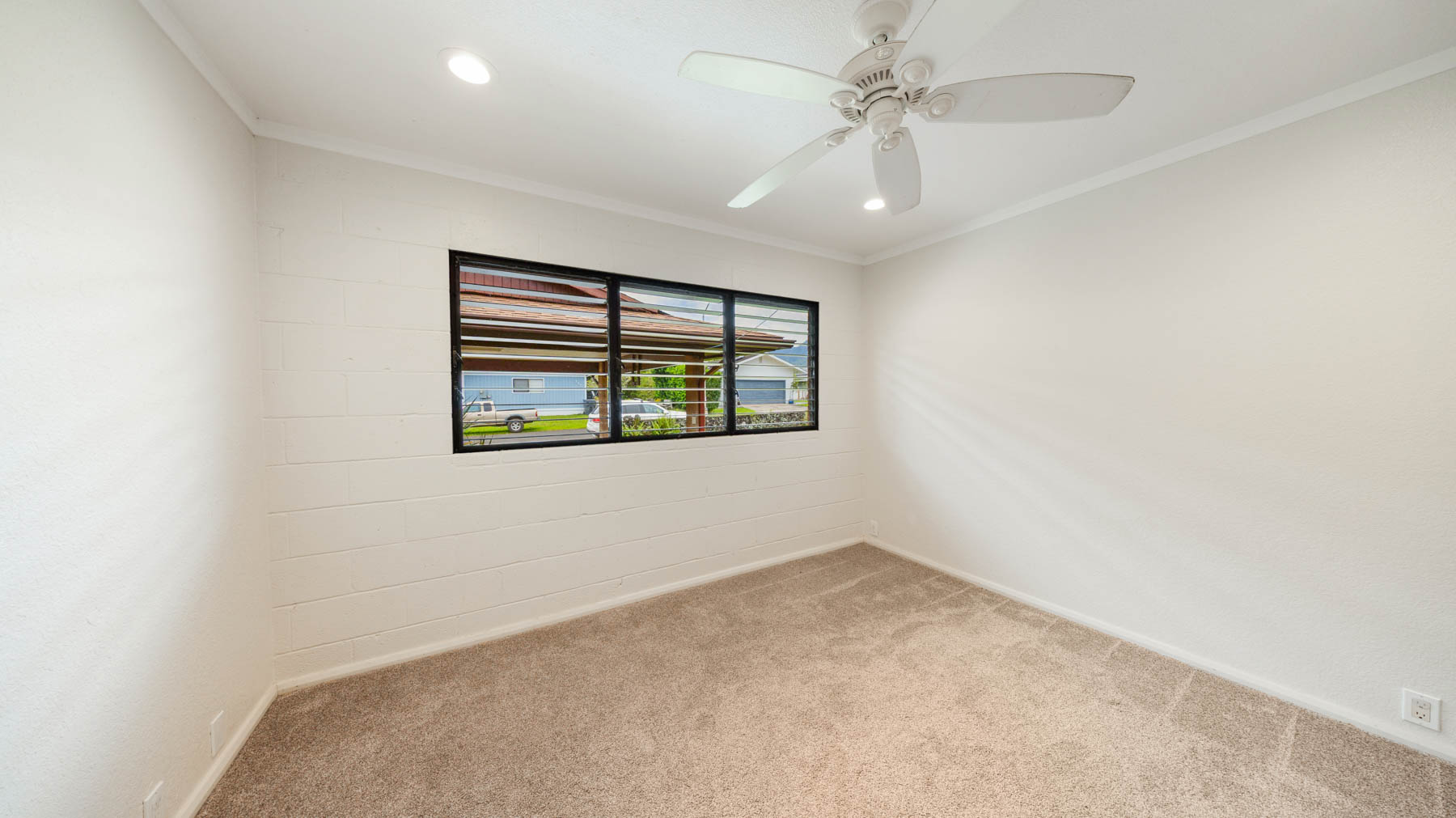 328 Molo Street Kapaa, HI 96746 - Photo 18 of 30 an empty room with windows and fan