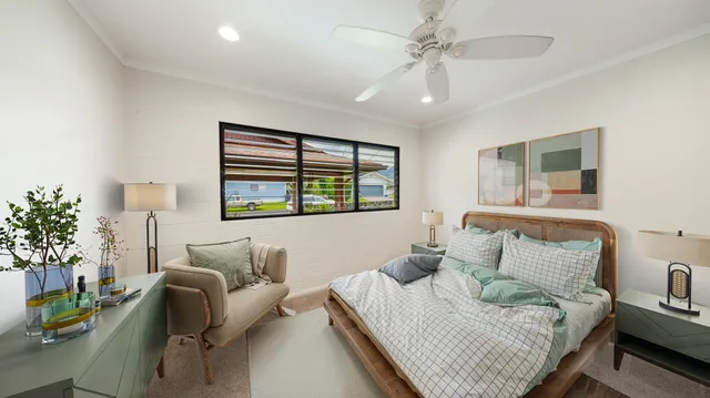 a bedroom with furniture and a large window