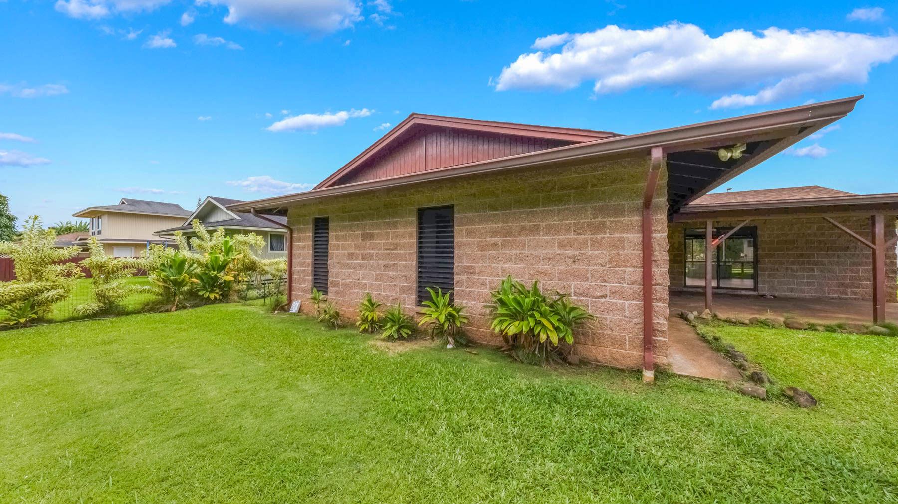 328 Molo Street Kapaa, HI 96746 - Photo 24 of 30 a front view of a house with a garden