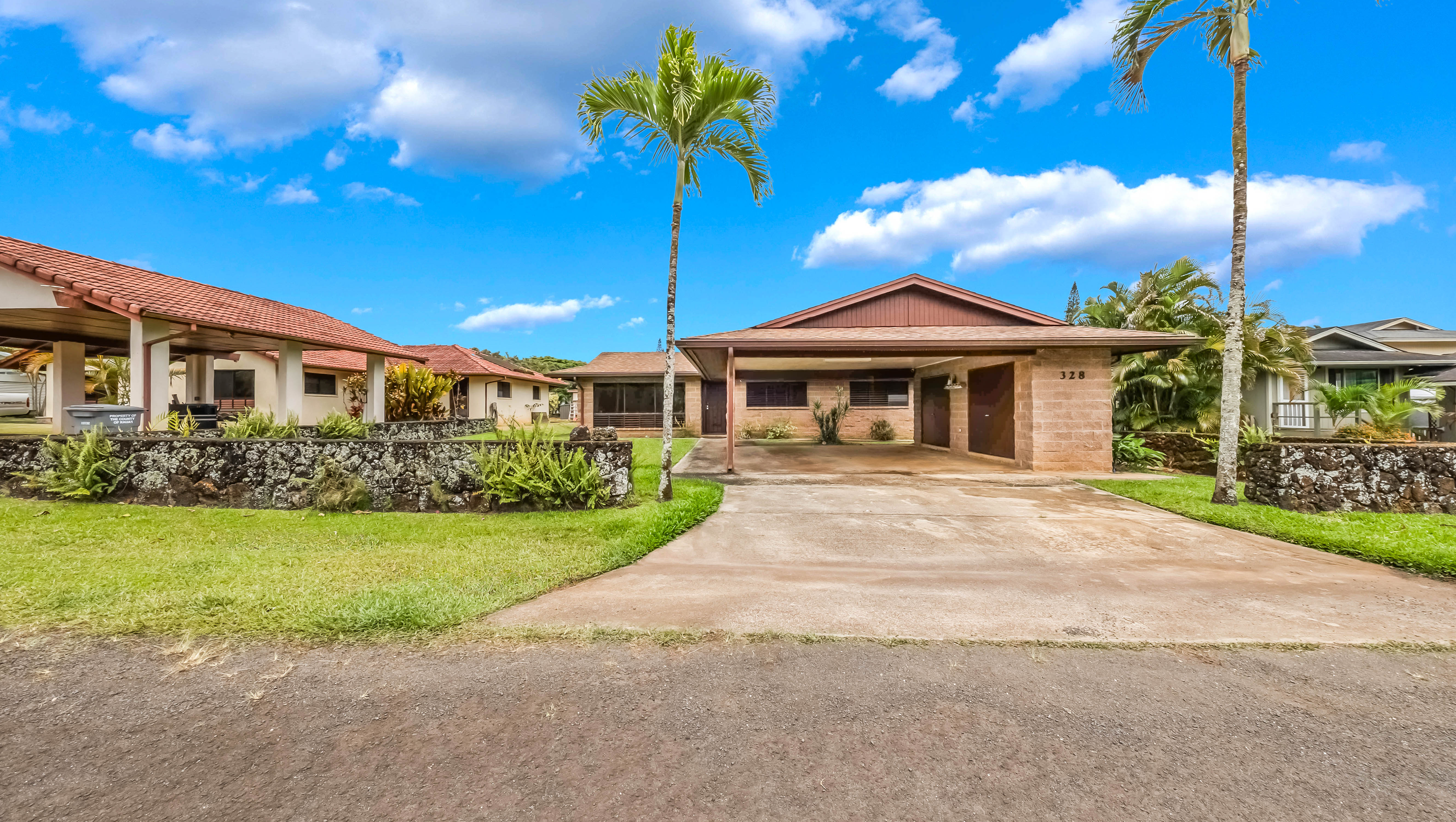 328 Molo Street Kapaa, HI 96746 - Photo 30 of 30 a front view of a house with garden