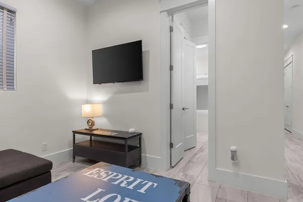 a kitchen with white cabinets and a sink