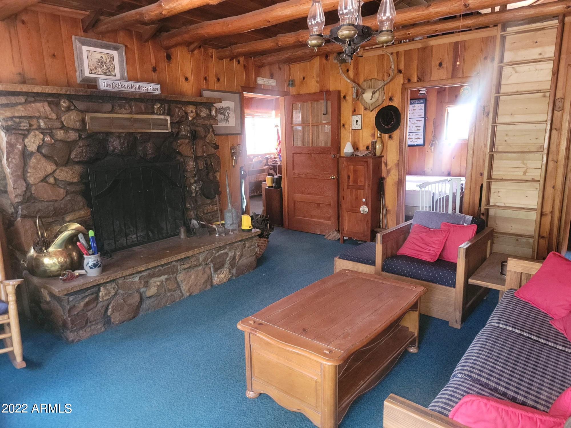391 West Diamond Road Payson, AZ 85541 - Photo 13 of 33 a living room with furniture and a fireplace