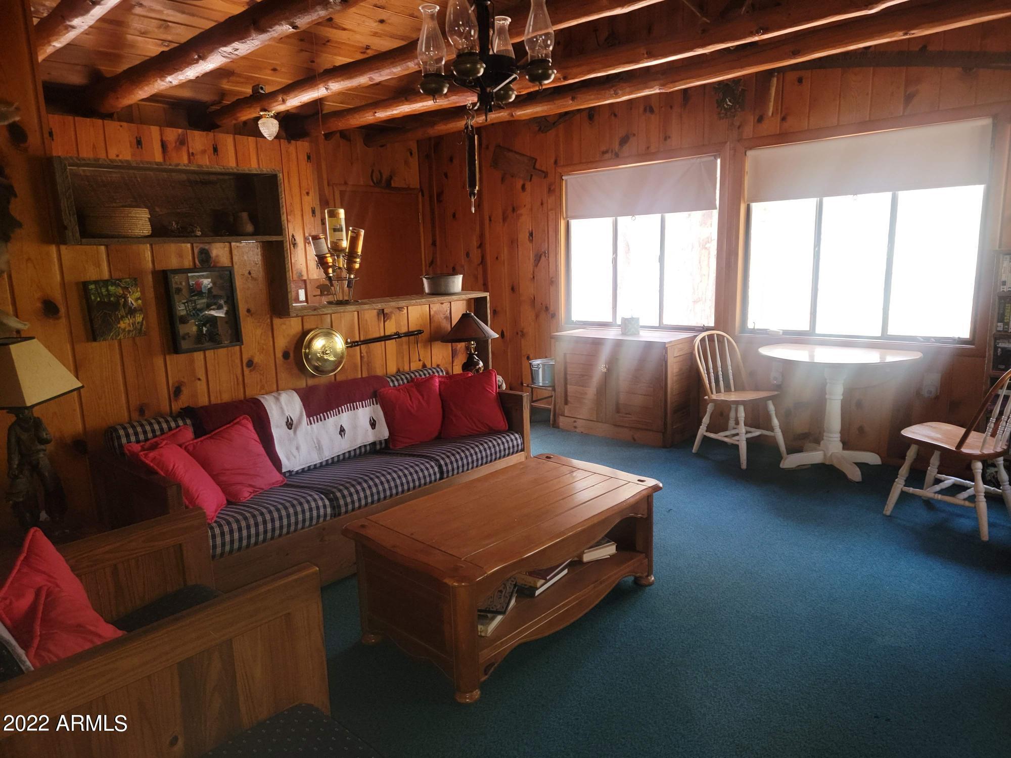 391 West Diamond Road Payson, AZ 85541 - Photo 16 of 33 a living room with furniture and a chandelier