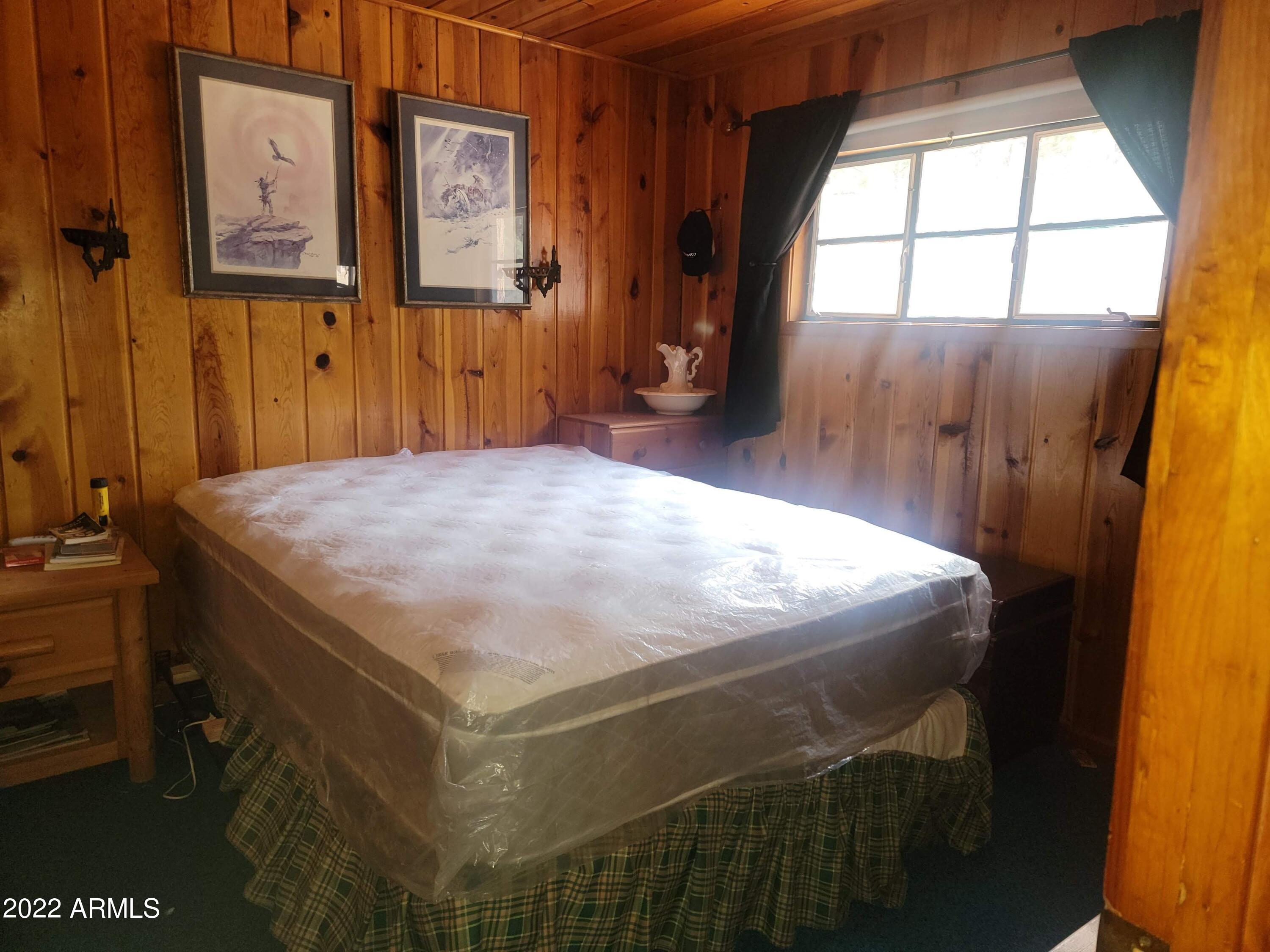 391 West Diamond Road Payson, AZ 85541 - Photo 17 of 33 a bed sitting in a bedroom next to a window