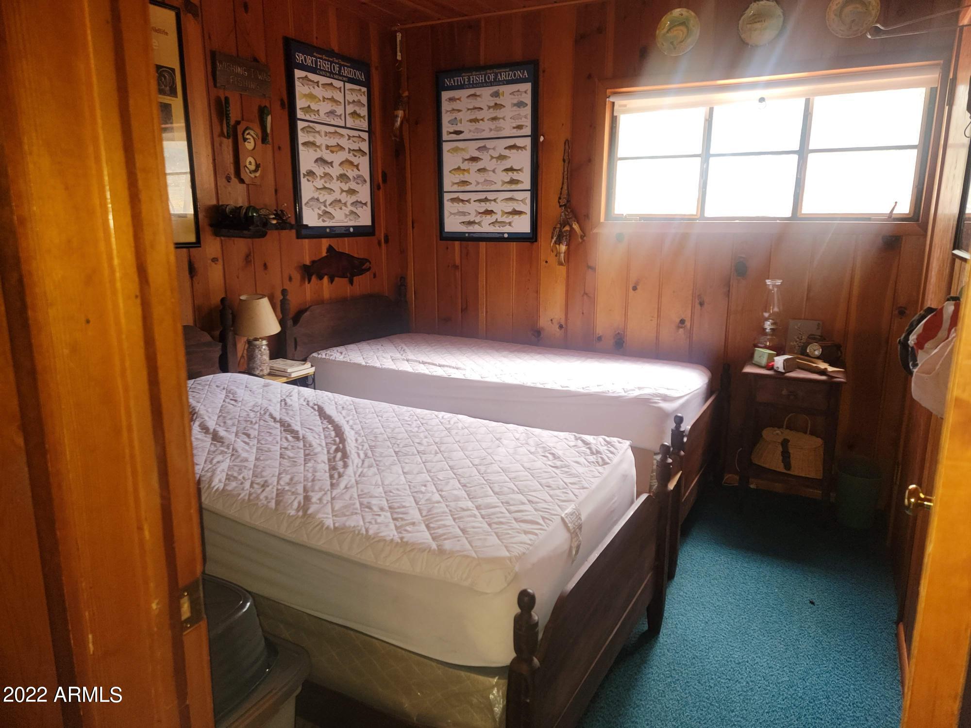 391 West Diamond Road Payson, AZ 85541 - Photo 18 of 33 a bed sitting in a bedroom next to a window