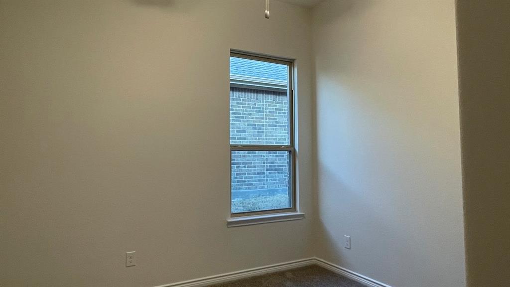 4189 Rim Trail Forney, TX 75126 - Photo 11 of 17 a view of an empty room and window