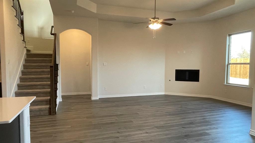 4189 Rim Trail Forney, TX 75126 - Photo 10 of 17 wooden floor in an empty room with a window