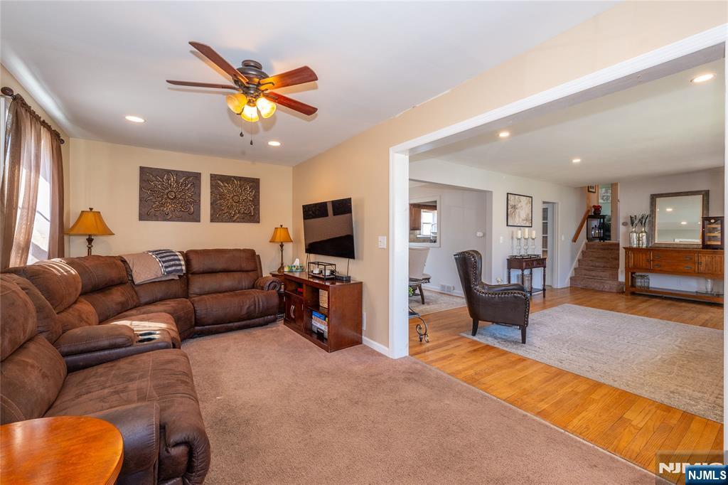54 Harrison Street Dumont, NJ 07628 - Photo 13 of 35 a living room with furniture and a flat screen tv