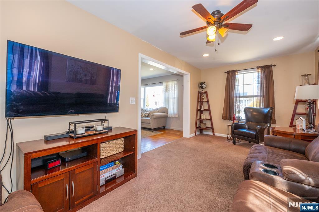 54 Harrison Street Dumont, NJ 07628 - Photo 15 of 35 a living room with furniture and a flat screen tv