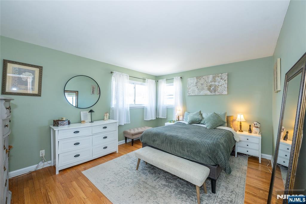 54 Harrison Street Dumont, NJ 07628 - Photo 16 of 35 a bedroom with a bed and a dresser