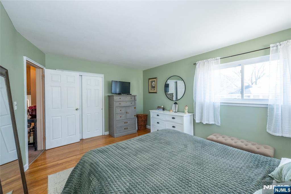 54 Harrison Street Dumont, NJ 07628 - Photo 17 of 35 a bed room with a bed and a dresser